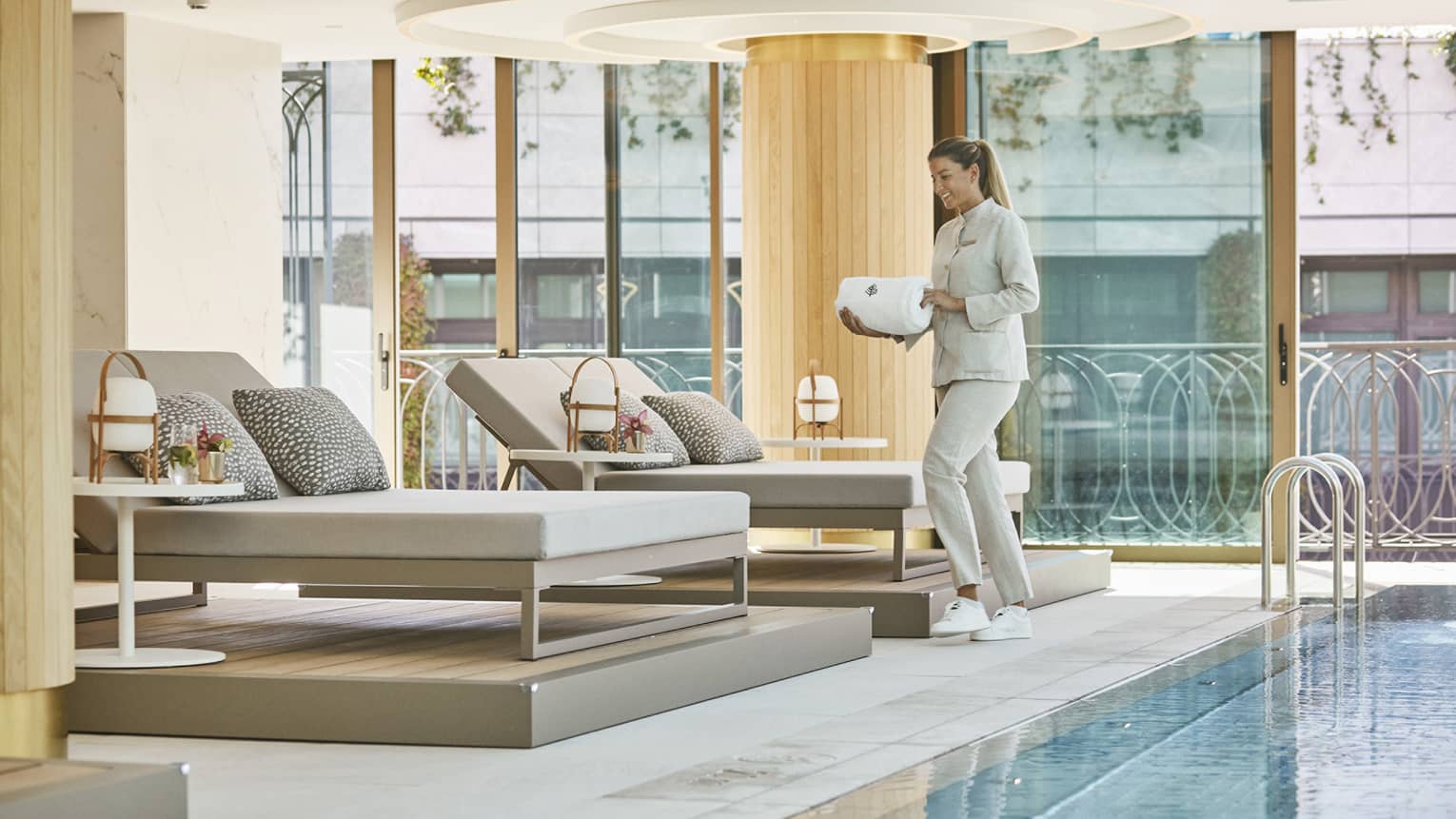 Poolside loungers and skylit wellness space at Four Seasons Madrid